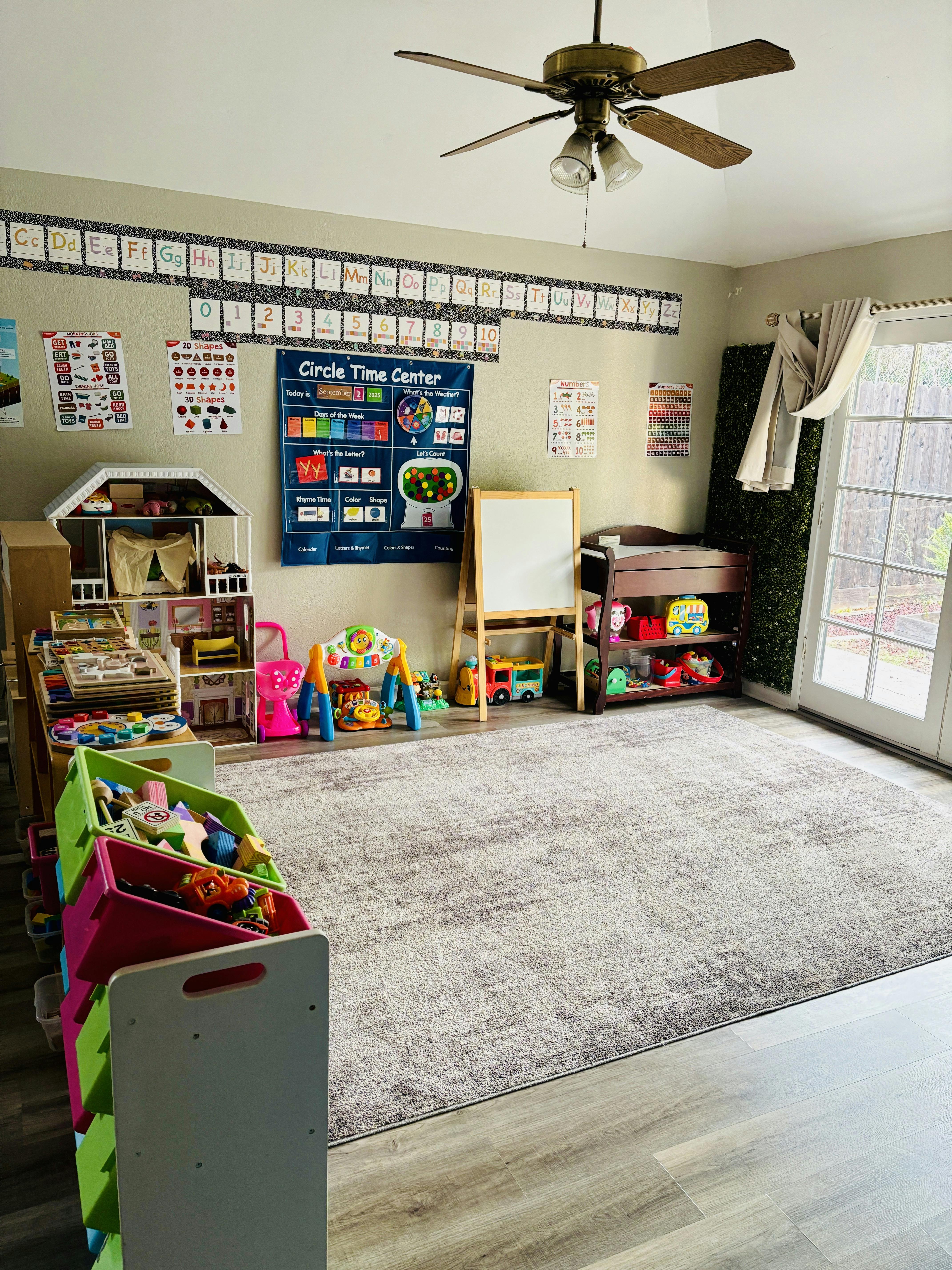 Classroom or playroom interior with educational wall charts and toy storage