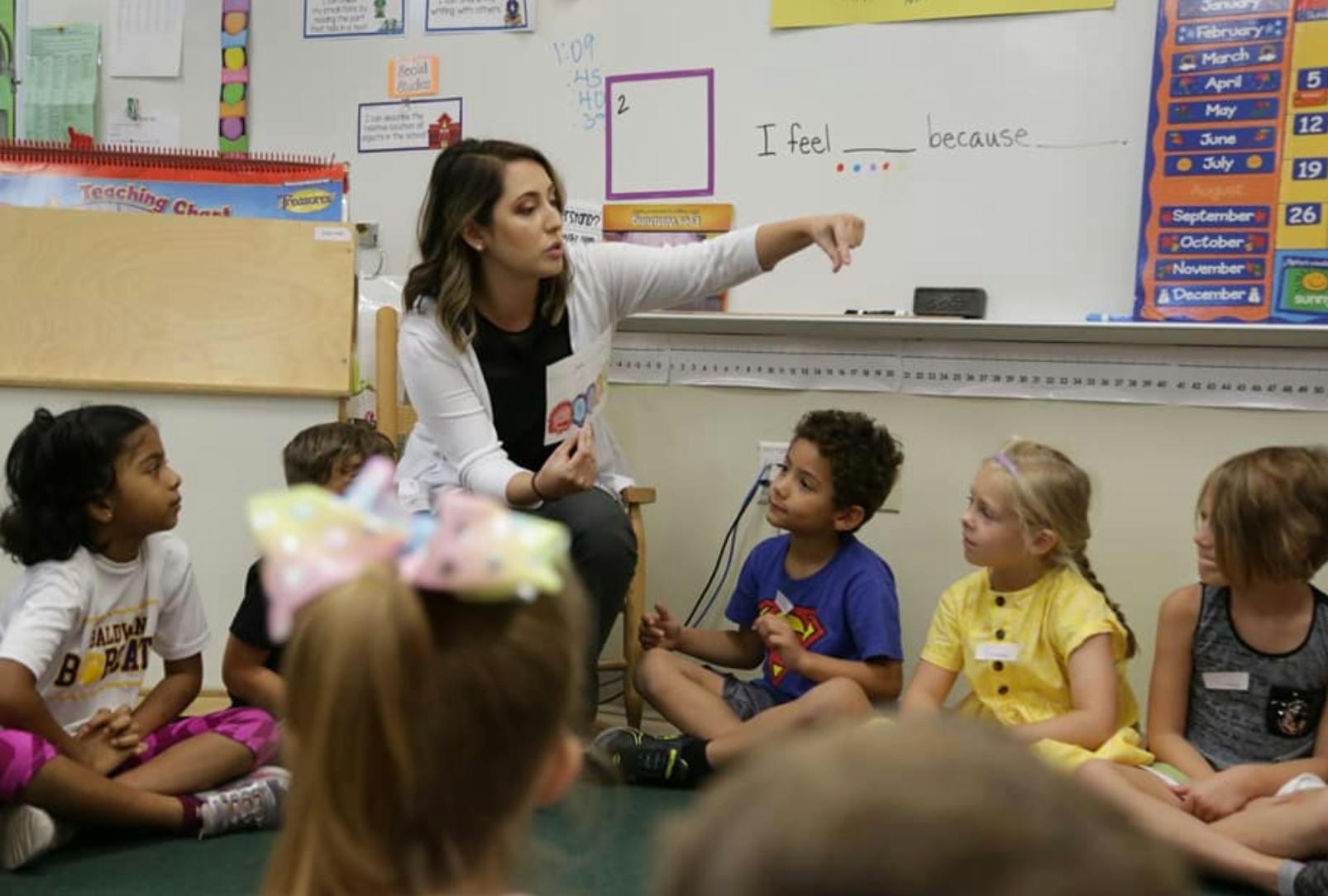 Person teaching children in a classroom