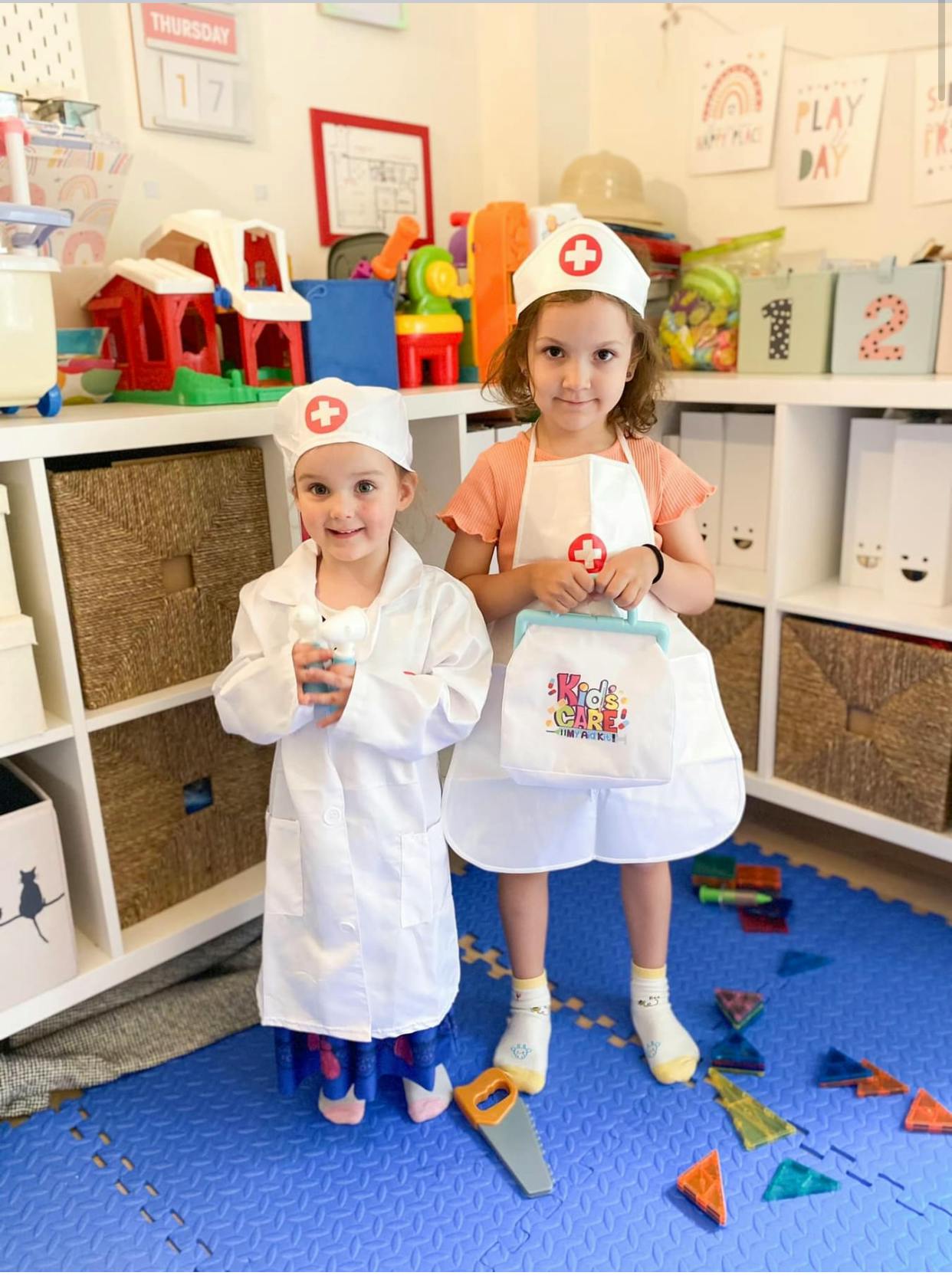 Two children in doctor and nurse costumes