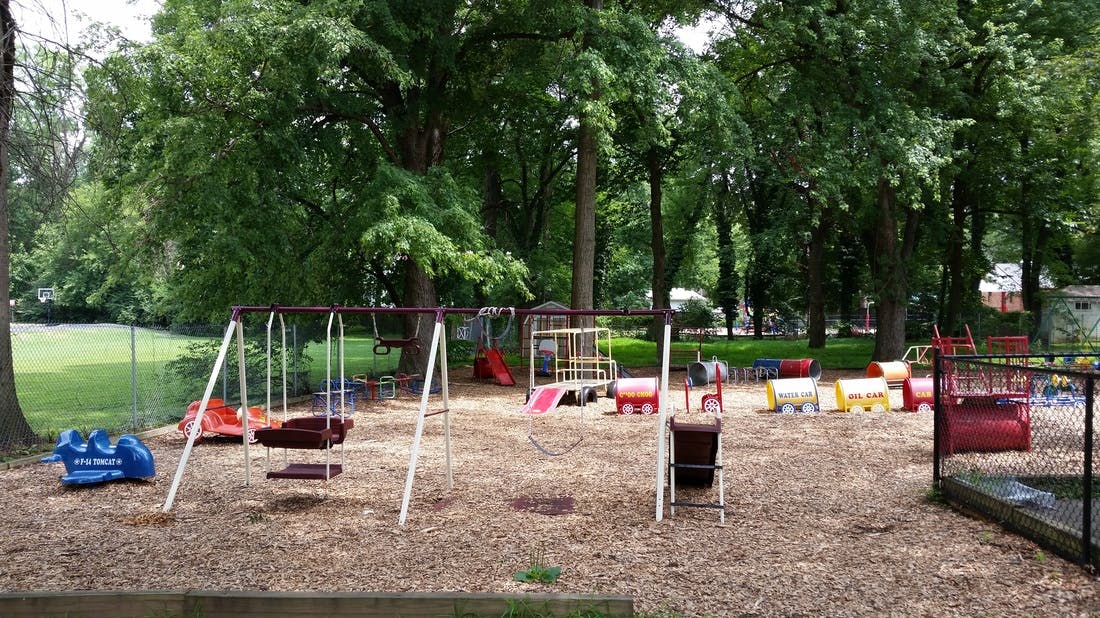 Playground with swings, slides, and other play equipment