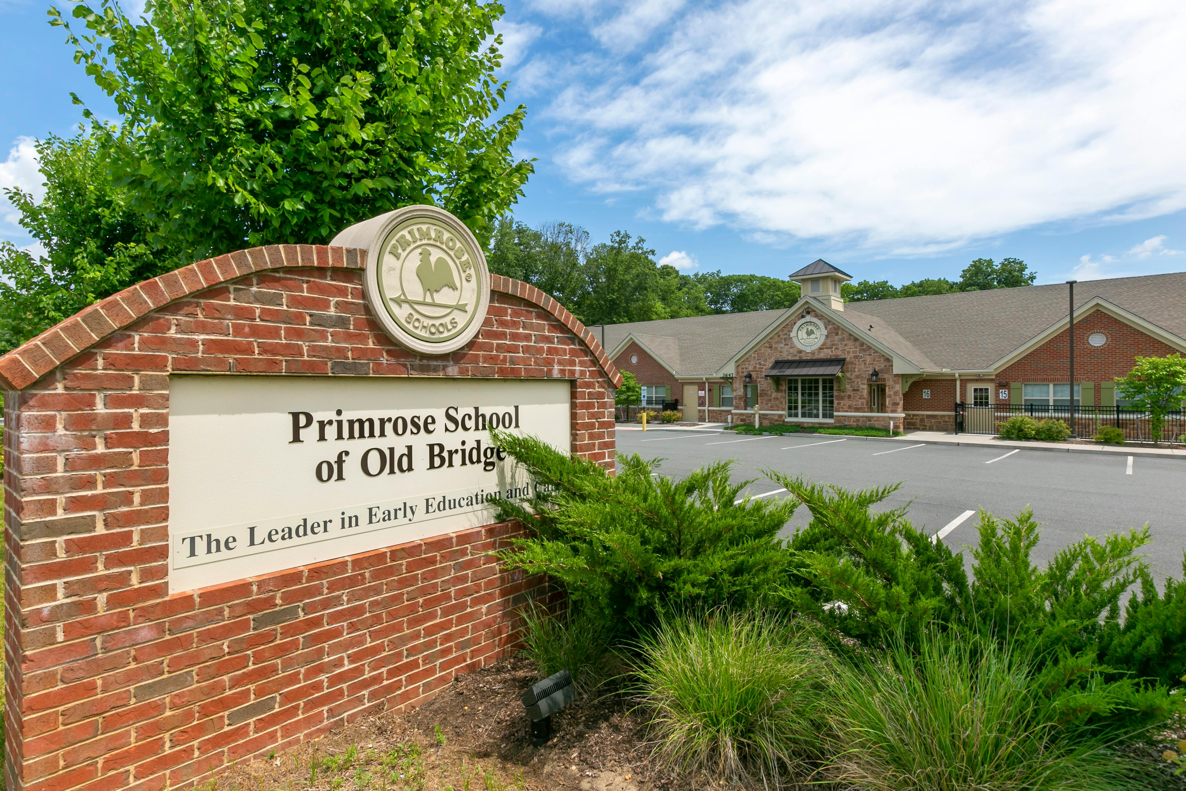 Primrose School of Old Bridge sign with building and parking lot in background