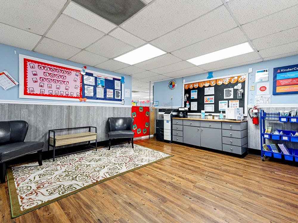 Classroom entryway with bulletin boards, chairs, and a counter