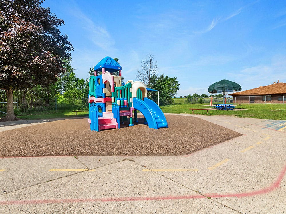 Colorful outdoor playground with slides and climbing structures