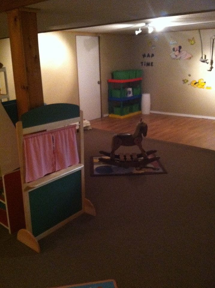 Playroom with a puppet theater and rocking horse