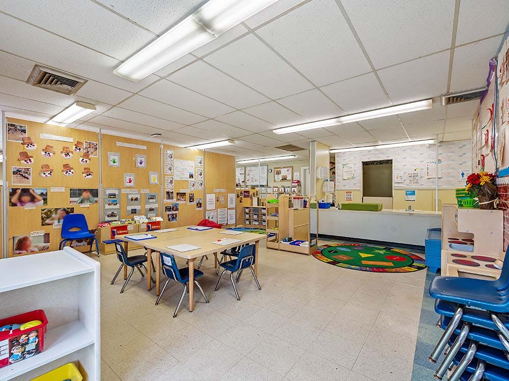 Empty classroom with tables and chairs