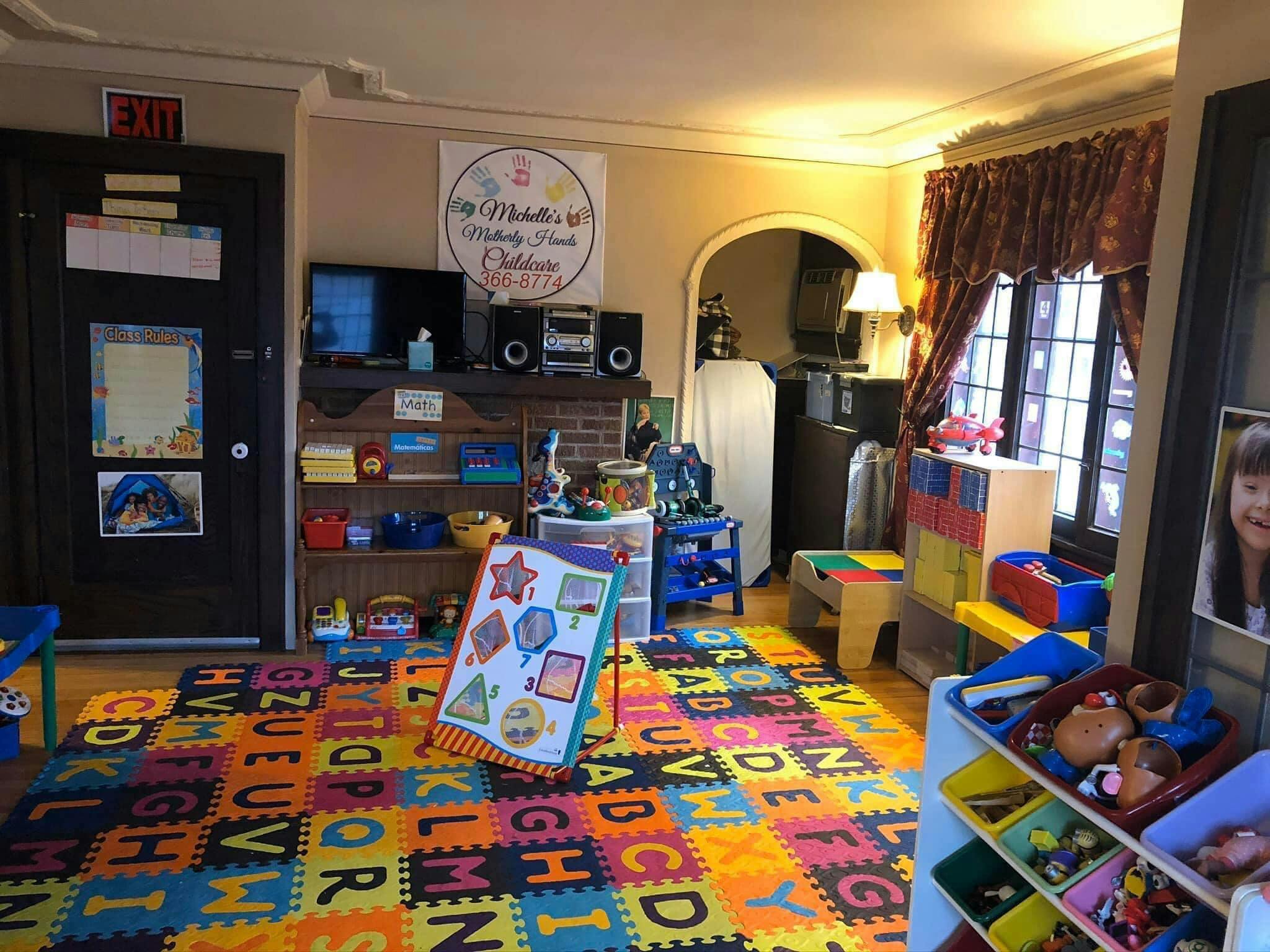 Playroom with alphabet mat, toys, and furniture