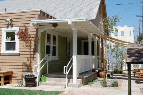 Front porch of a house with steps and railings