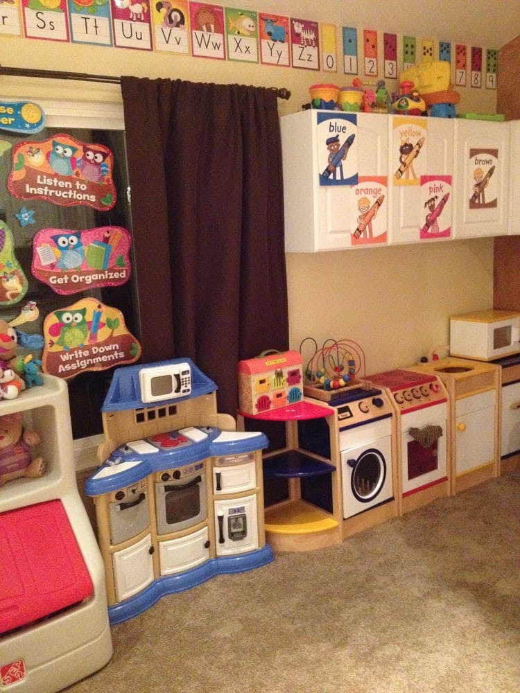 Children's play kitchen and appliances in a classroom