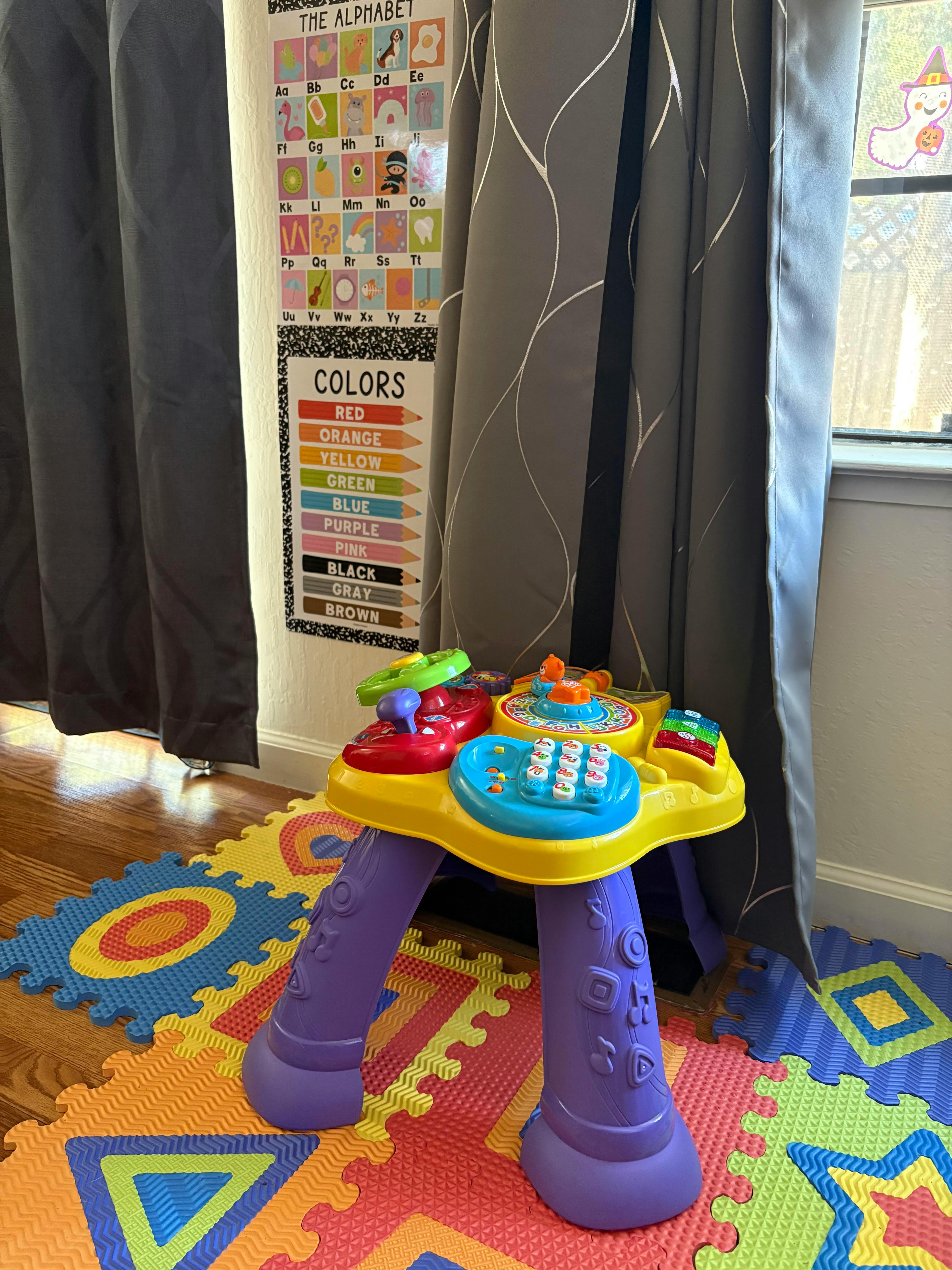 Child's activity table on a colorful foam mat