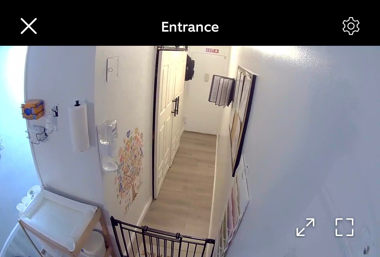 Interior hallway view with a baby changing table and a child safety gate