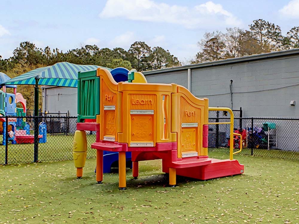 Colorful outdoor playground equipment with words play, learn, and run