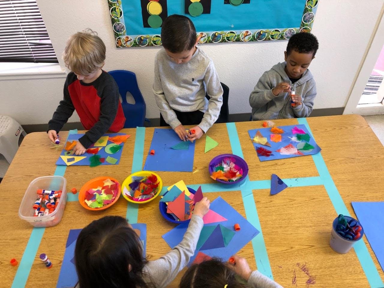 Children doing crafts at a table