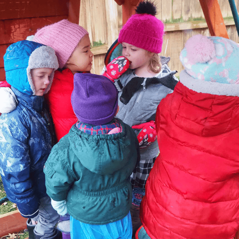 Group of children in winter hats and coats