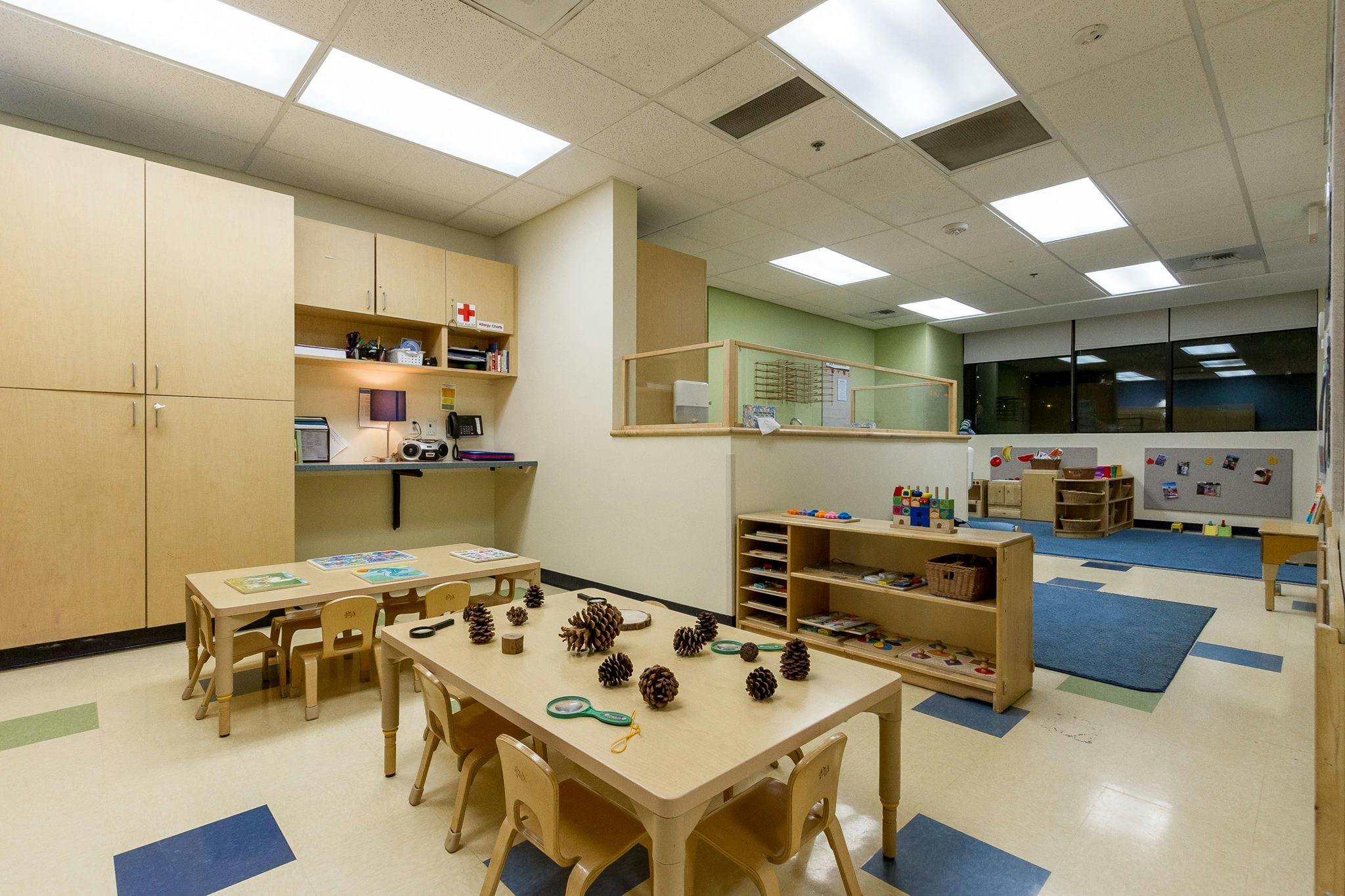 Empty classroom with small tables and chairs