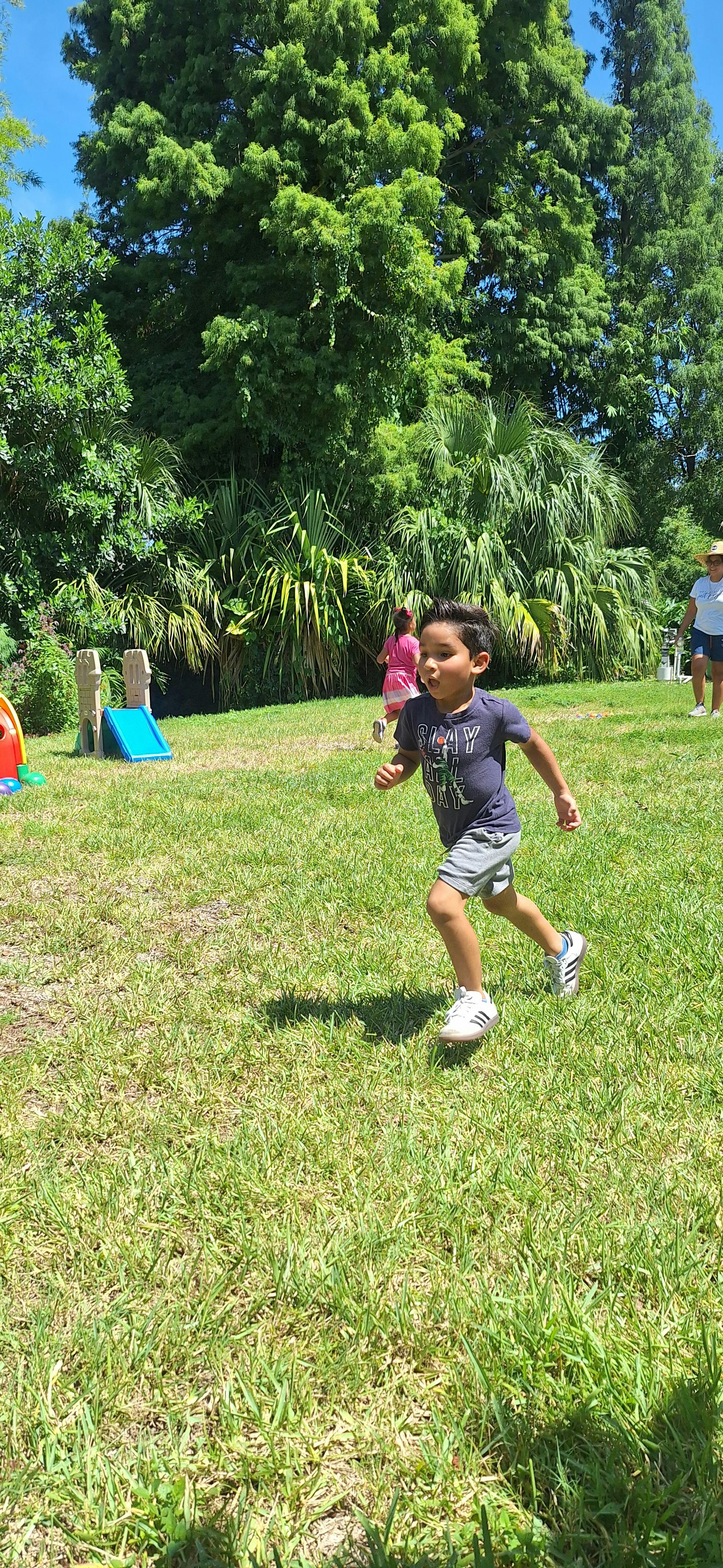 Child running on grass