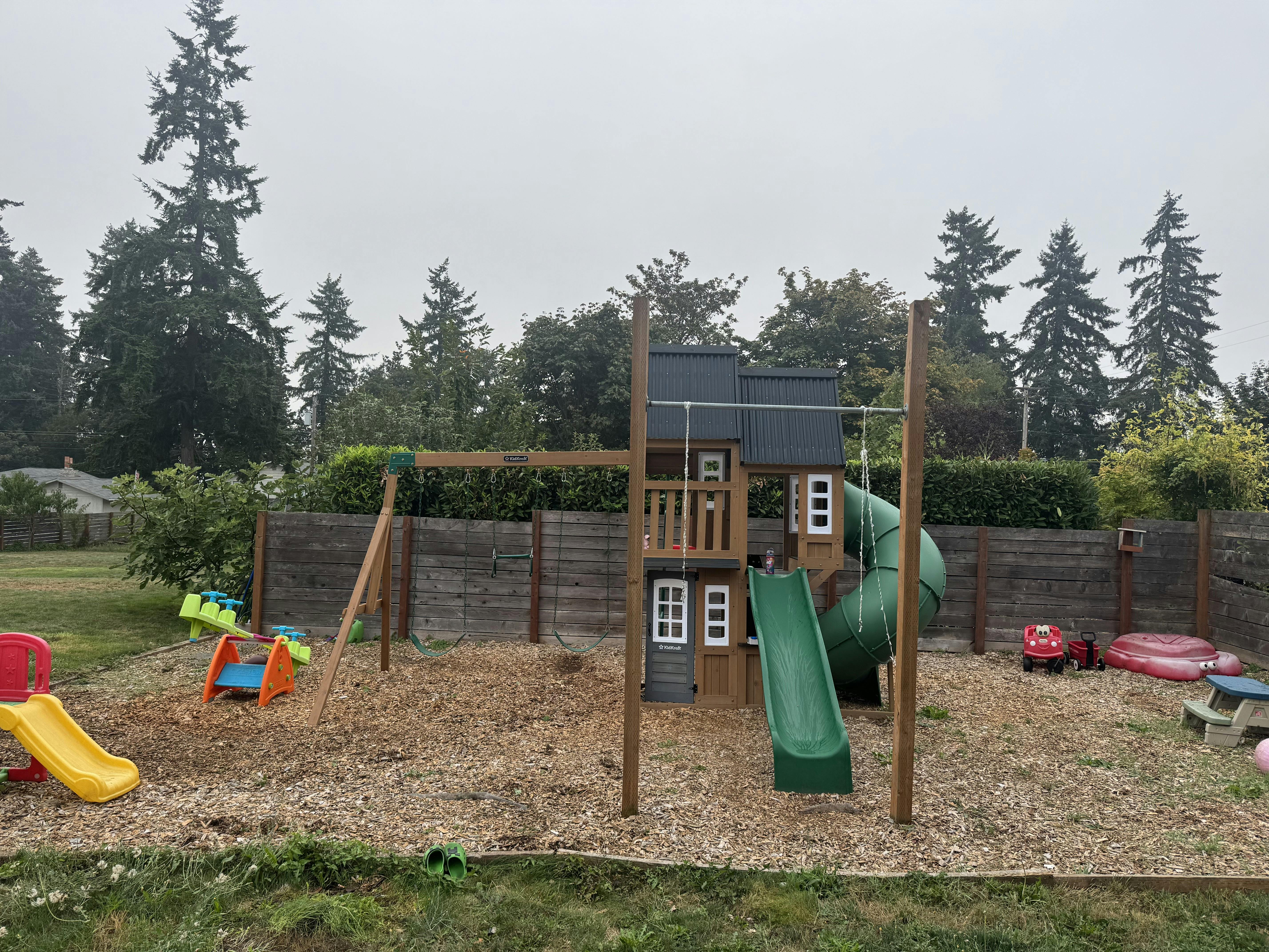 Playground with swings, slides, and play structure