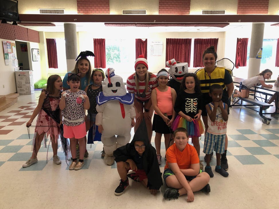 Group of children and adults in costumes