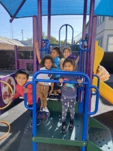 Children playing on a playground structure