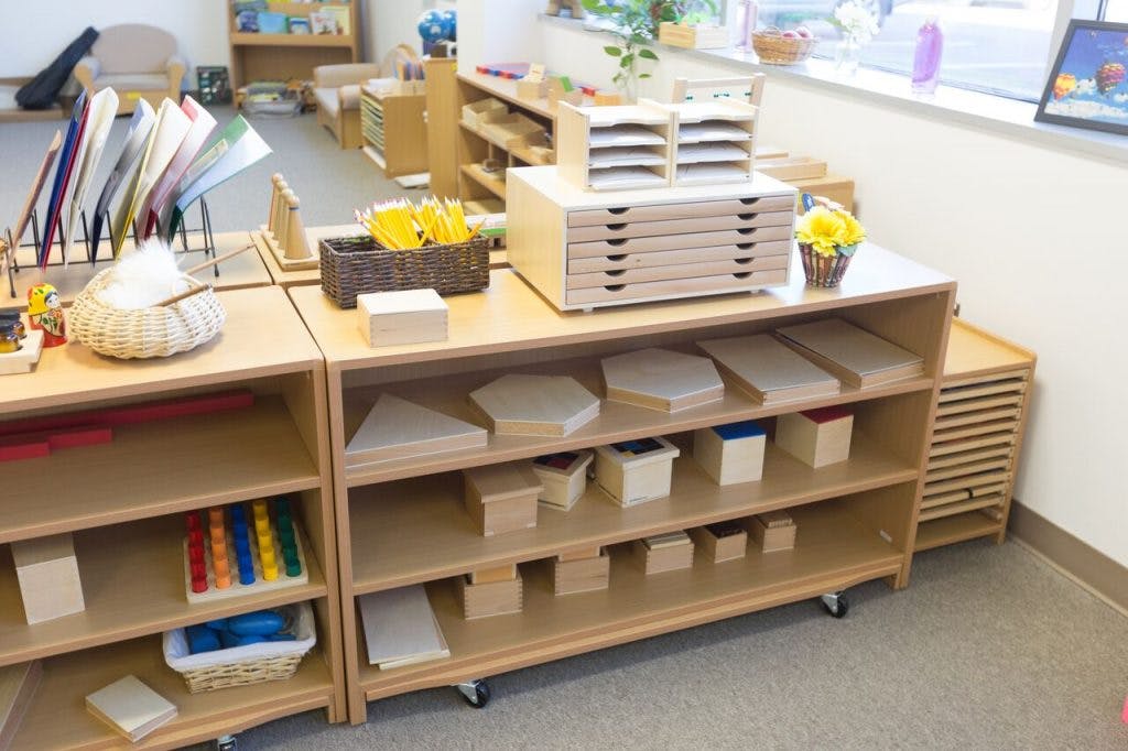Shelves with various learning materials in a classroom