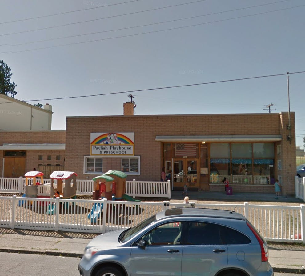 Building with a sign that reads "Playhouse & Preschool"