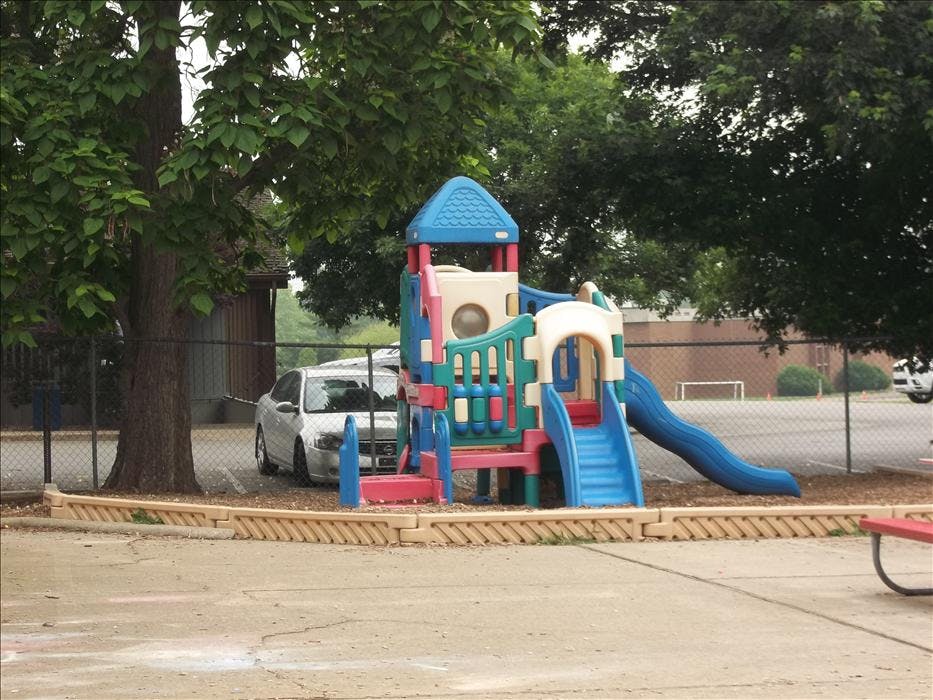 Colorful playground structure with slides and climbing areas