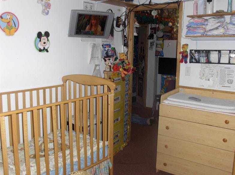 Baby crib and changing table in a room