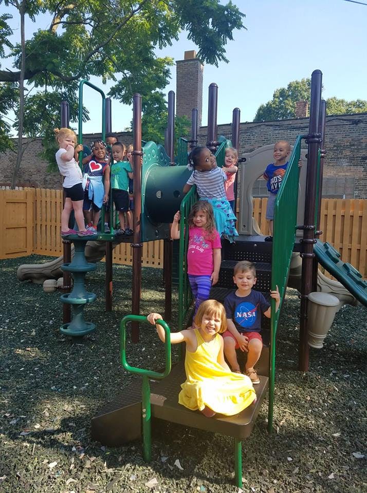 Children playing on a playground structure