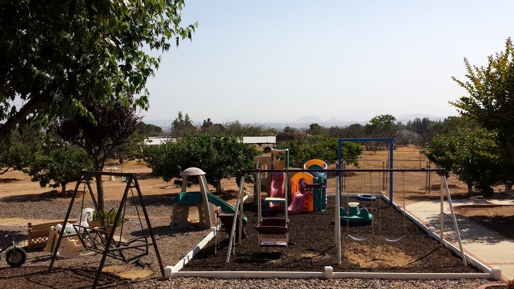 Outdoor playground with swings and slides