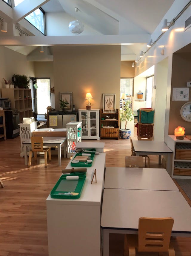 Classroom with tables, chairs, and learning materials