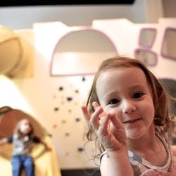 Child looking at camera, another child in background