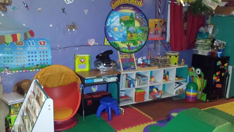 Classroom with colorful walls, furniture, and learning materials