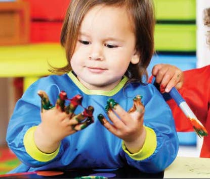 Child with paint on their hands