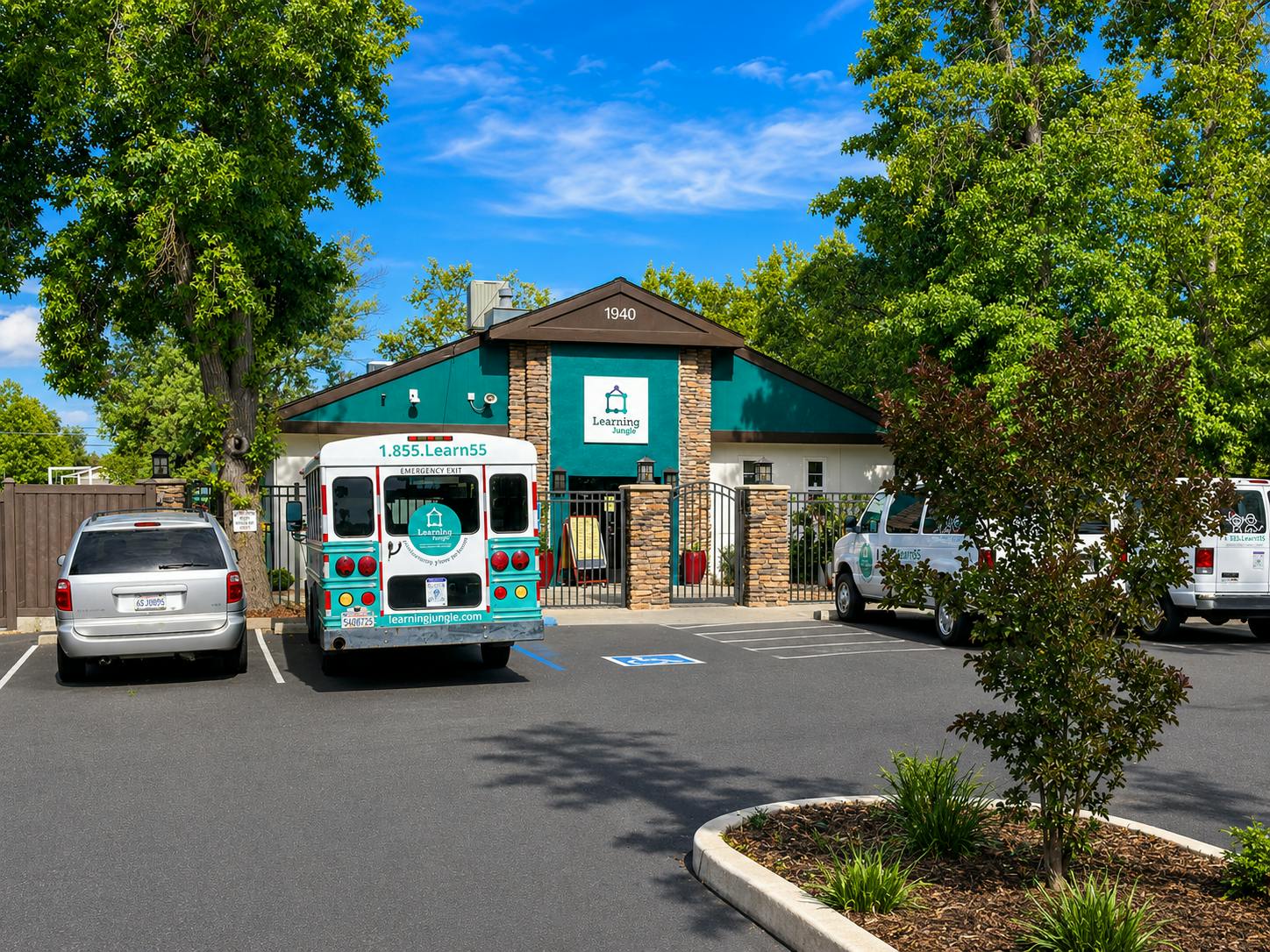 Learning Jungle building with parked vans and a bus in fronting the facility
