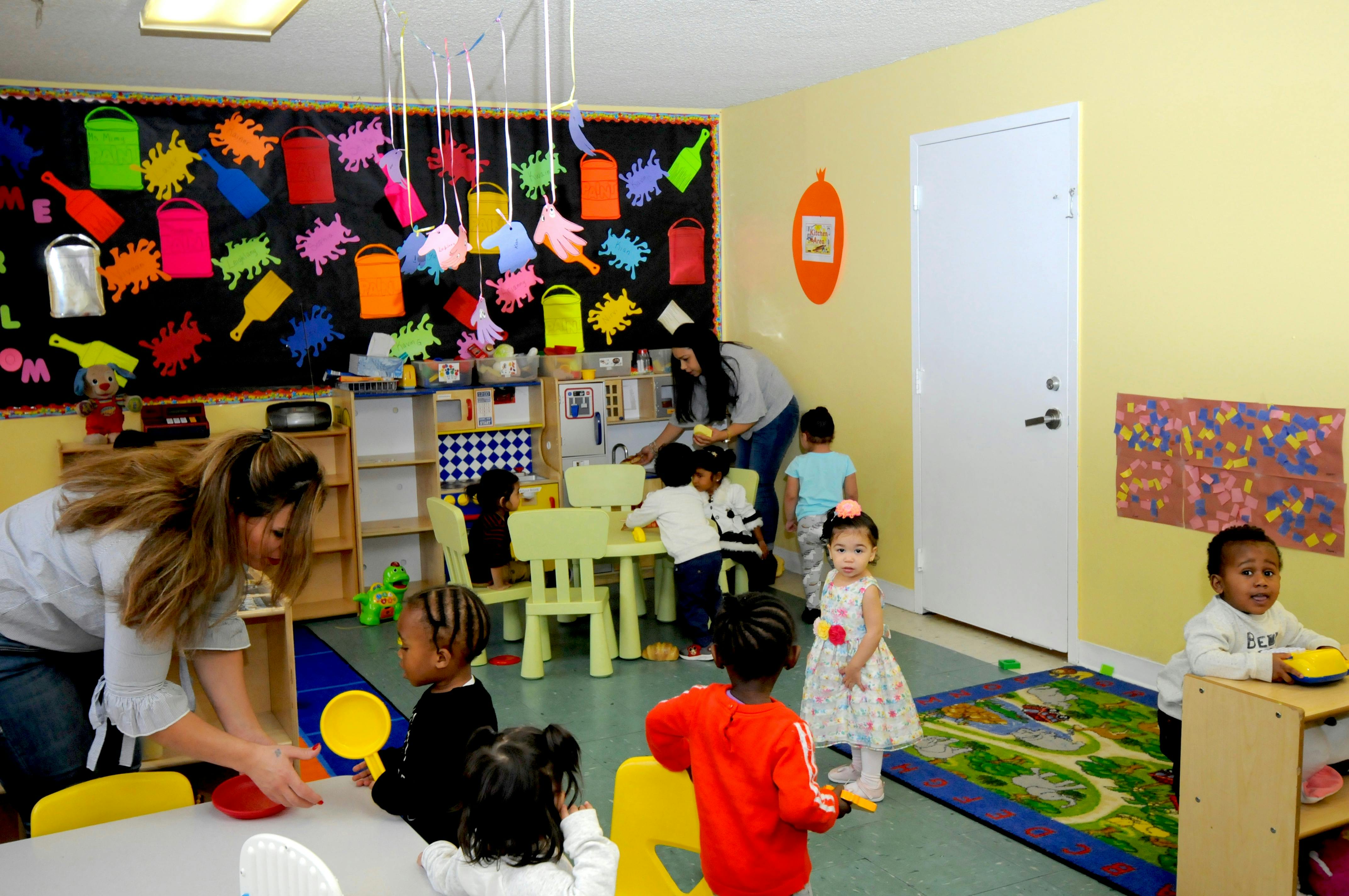 Adults and children in a classroom