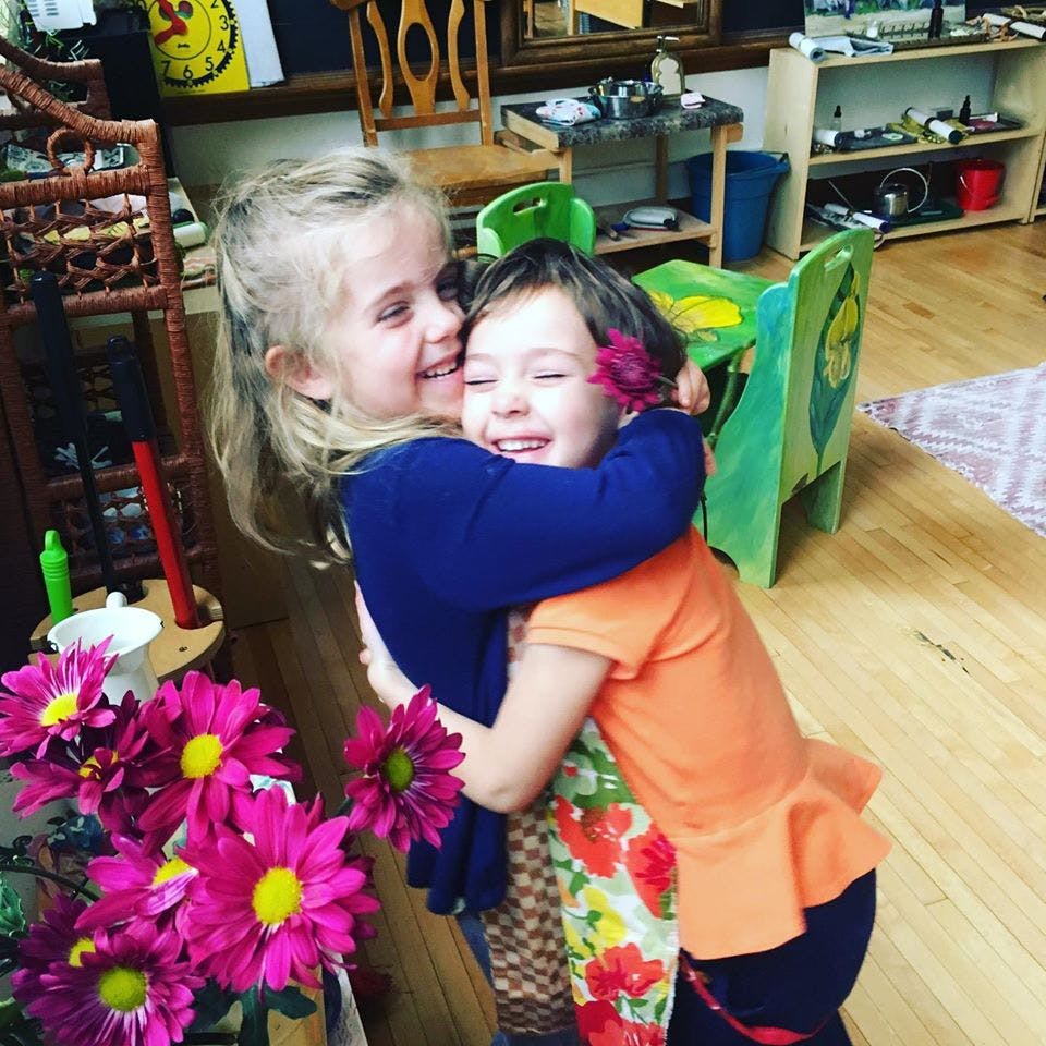 Two children hugging