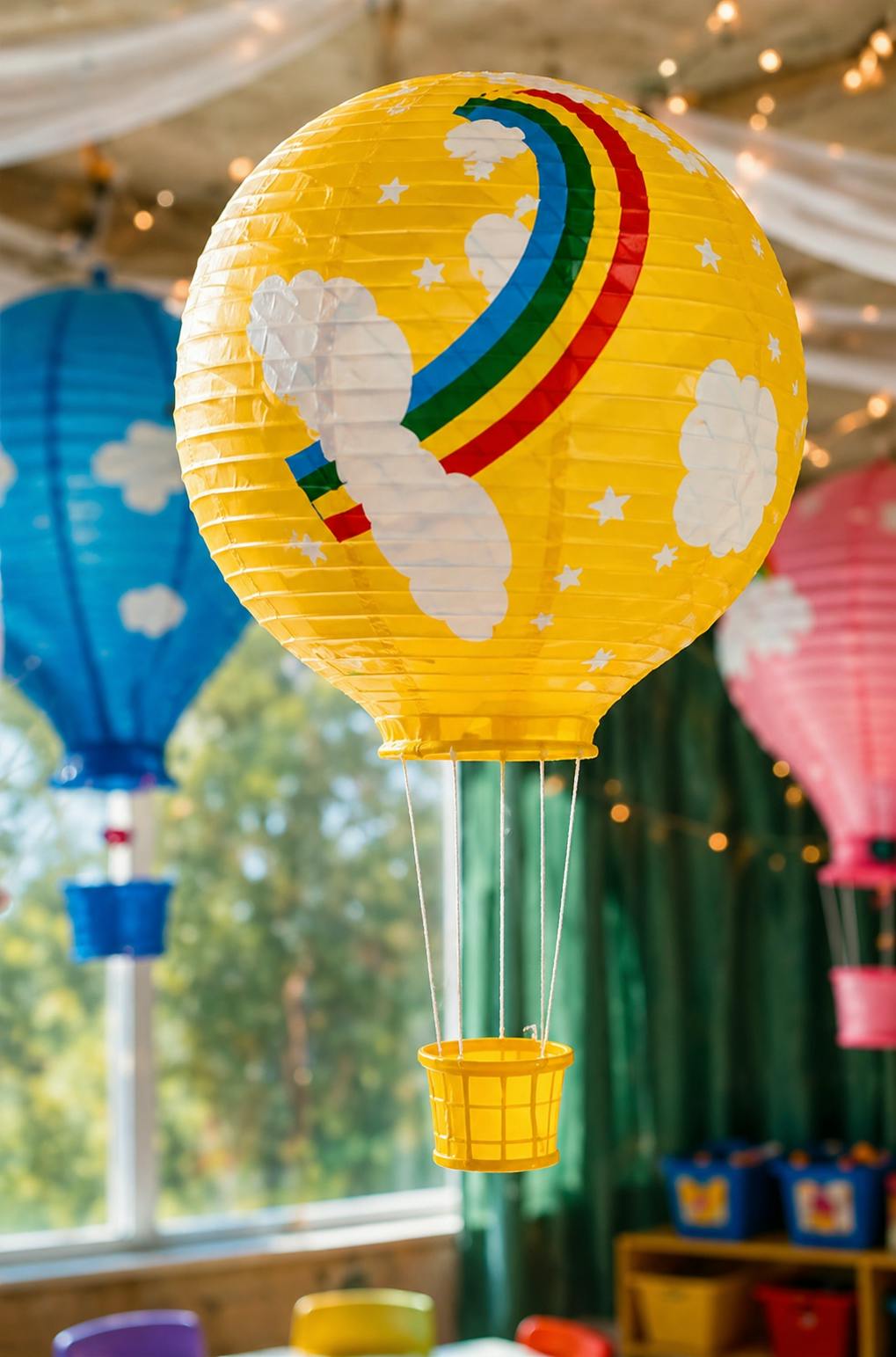 Yellow hot air balloon decoration with a rainbow and clouds