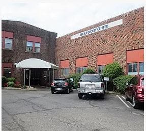 Building with a sign that reads "CROCE SOCIAL CENTER"