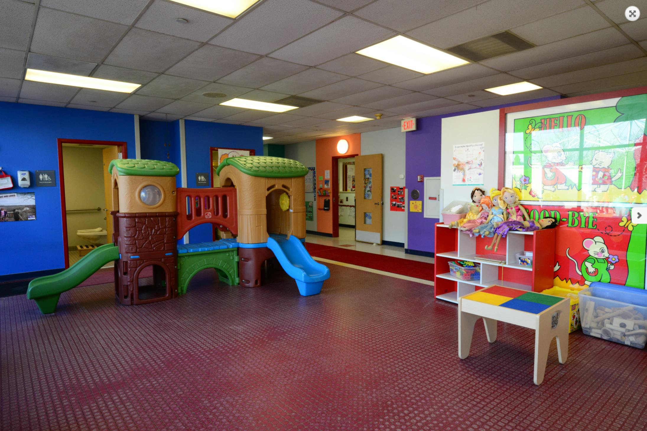 Indoor playground with slides and play structure