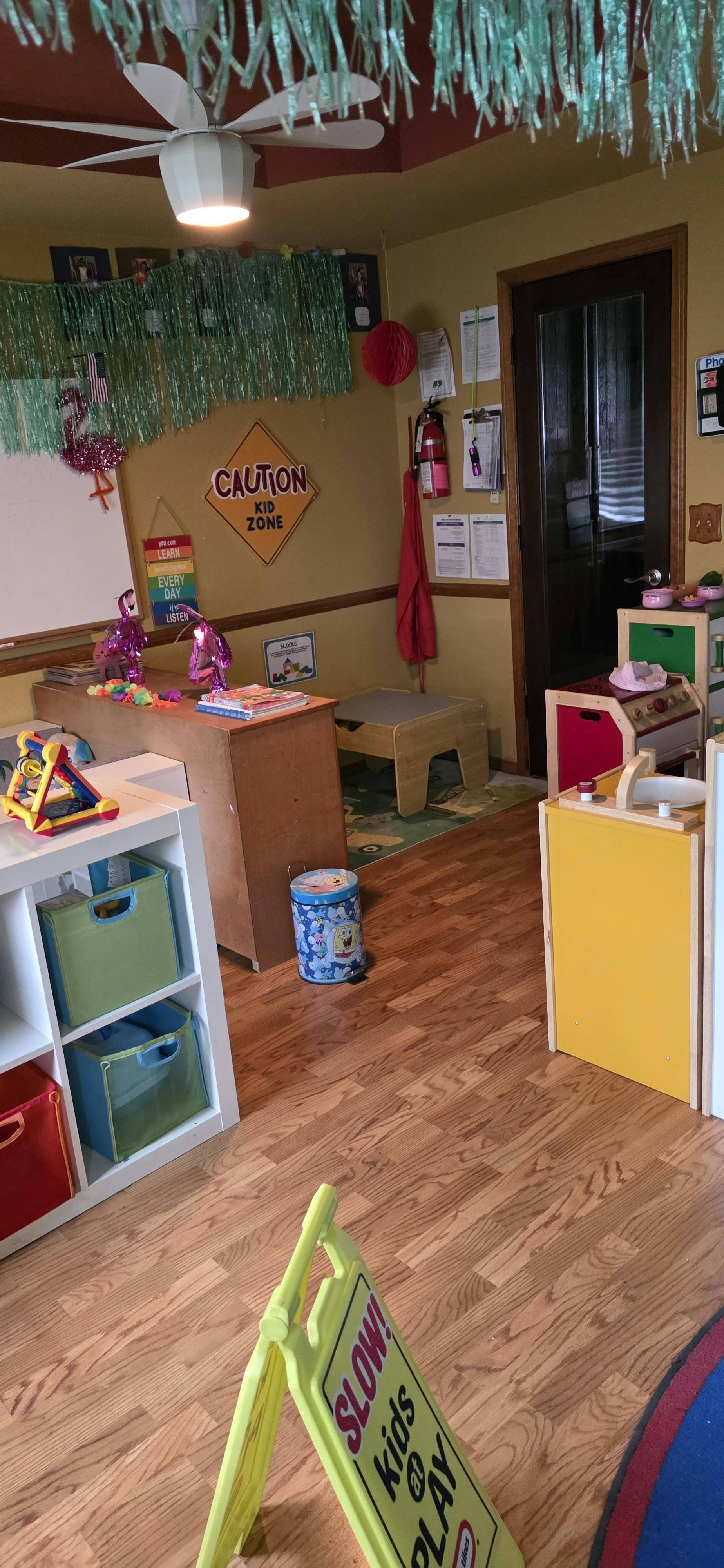 Classroom interior with play furniture and caution signs
