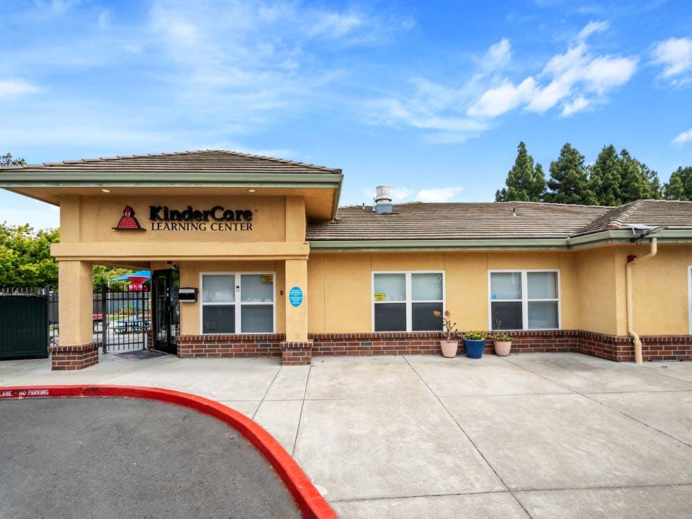 KinderCare Learning Center building exterior under a bright sky