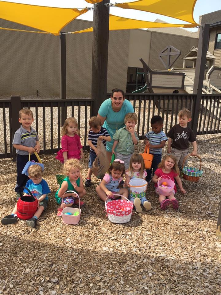 Adult and children holding baskets outdoors