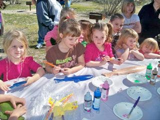 Children painting at a table