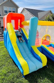 Child on an inflatable slide