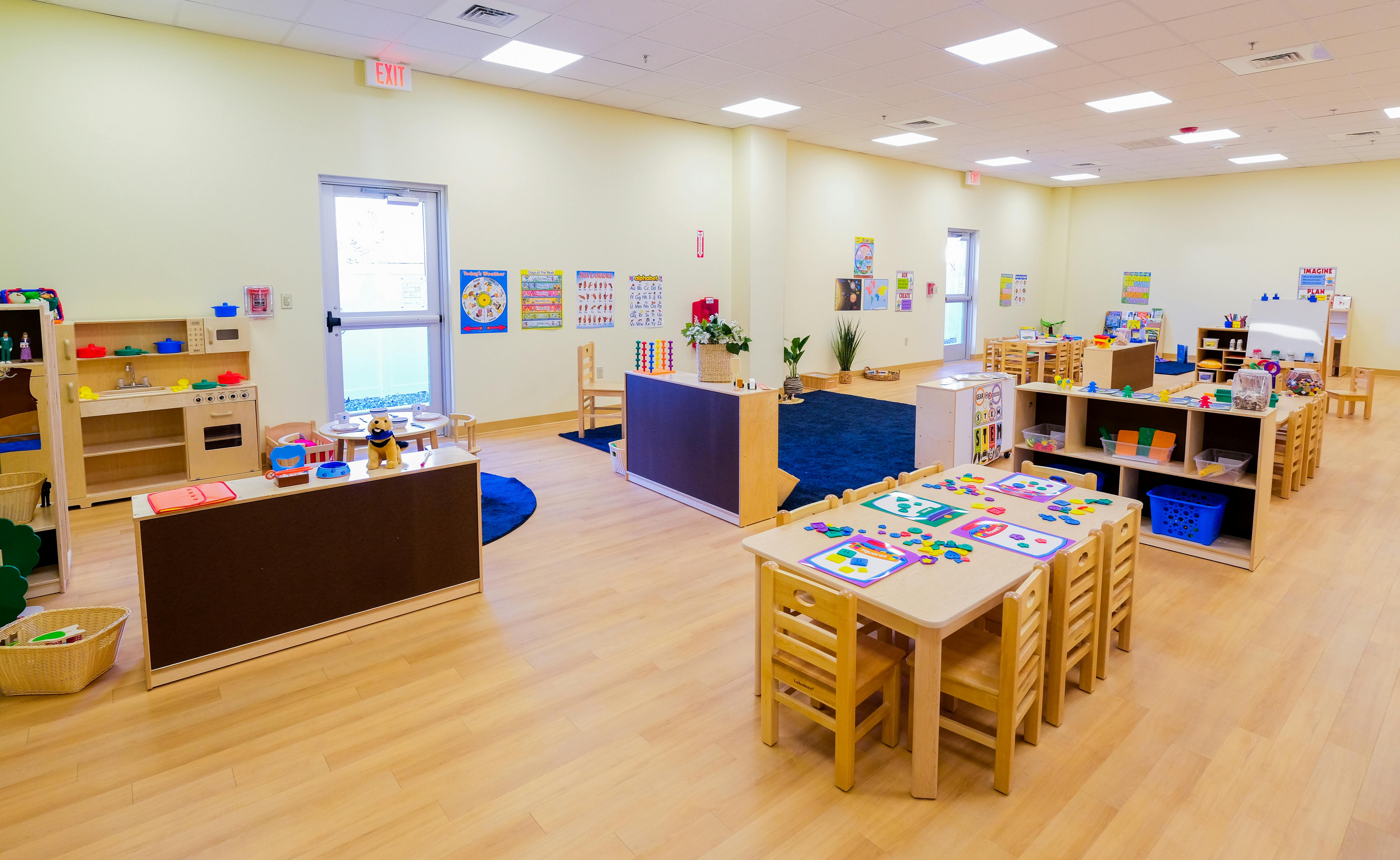 Empty classroom with small tables and chairs