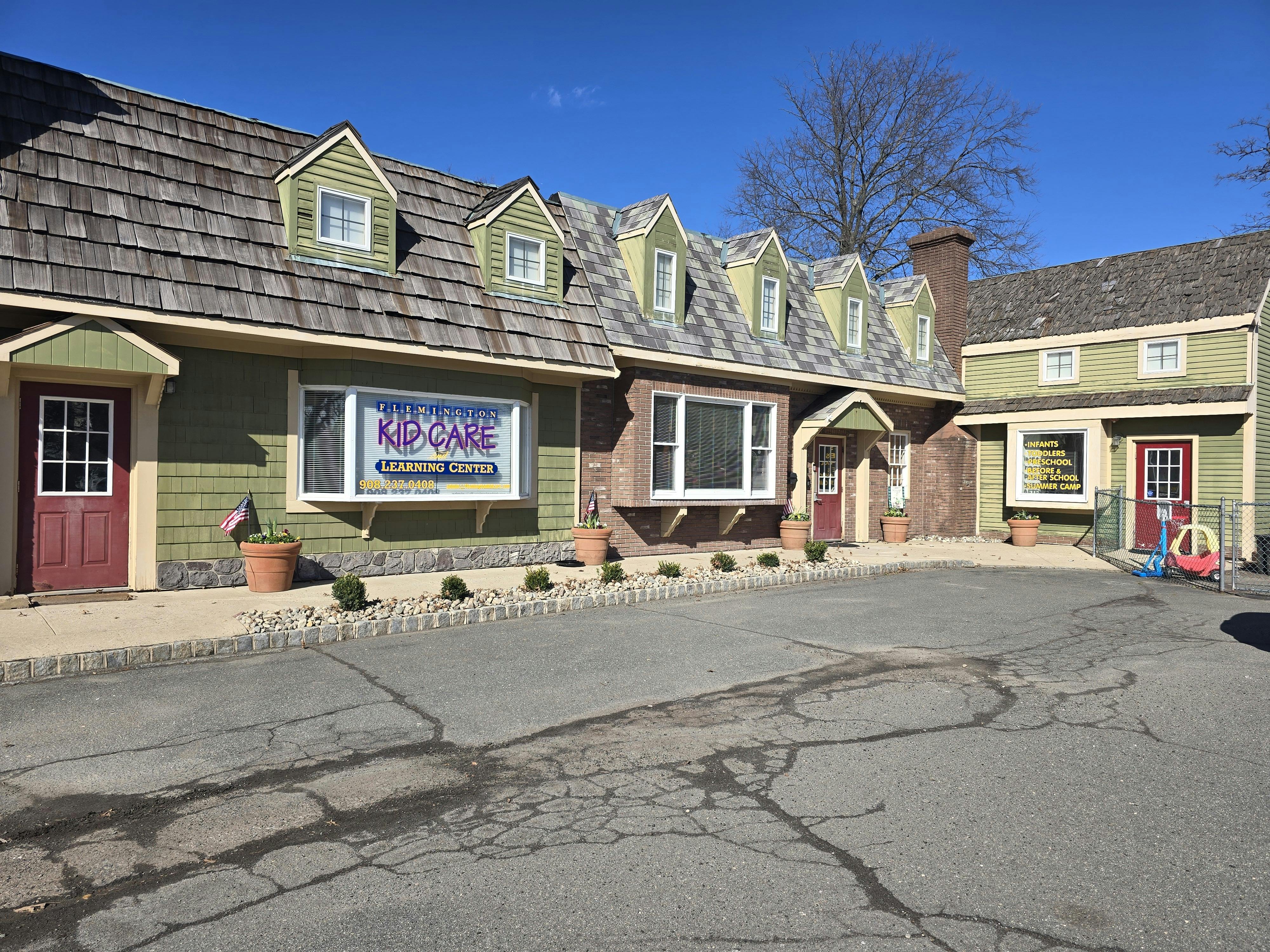 A low-rise building with a sign that reads "FLEMINGTON KID CARE LEARNING CENTER"