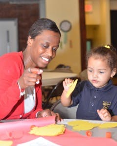 Adult and child doing an art project