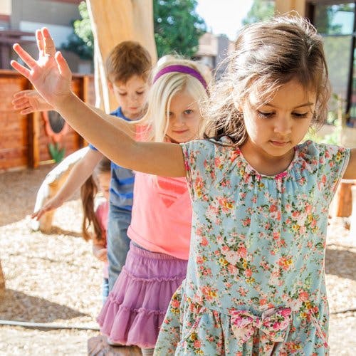 Children balancing with arms outstretched