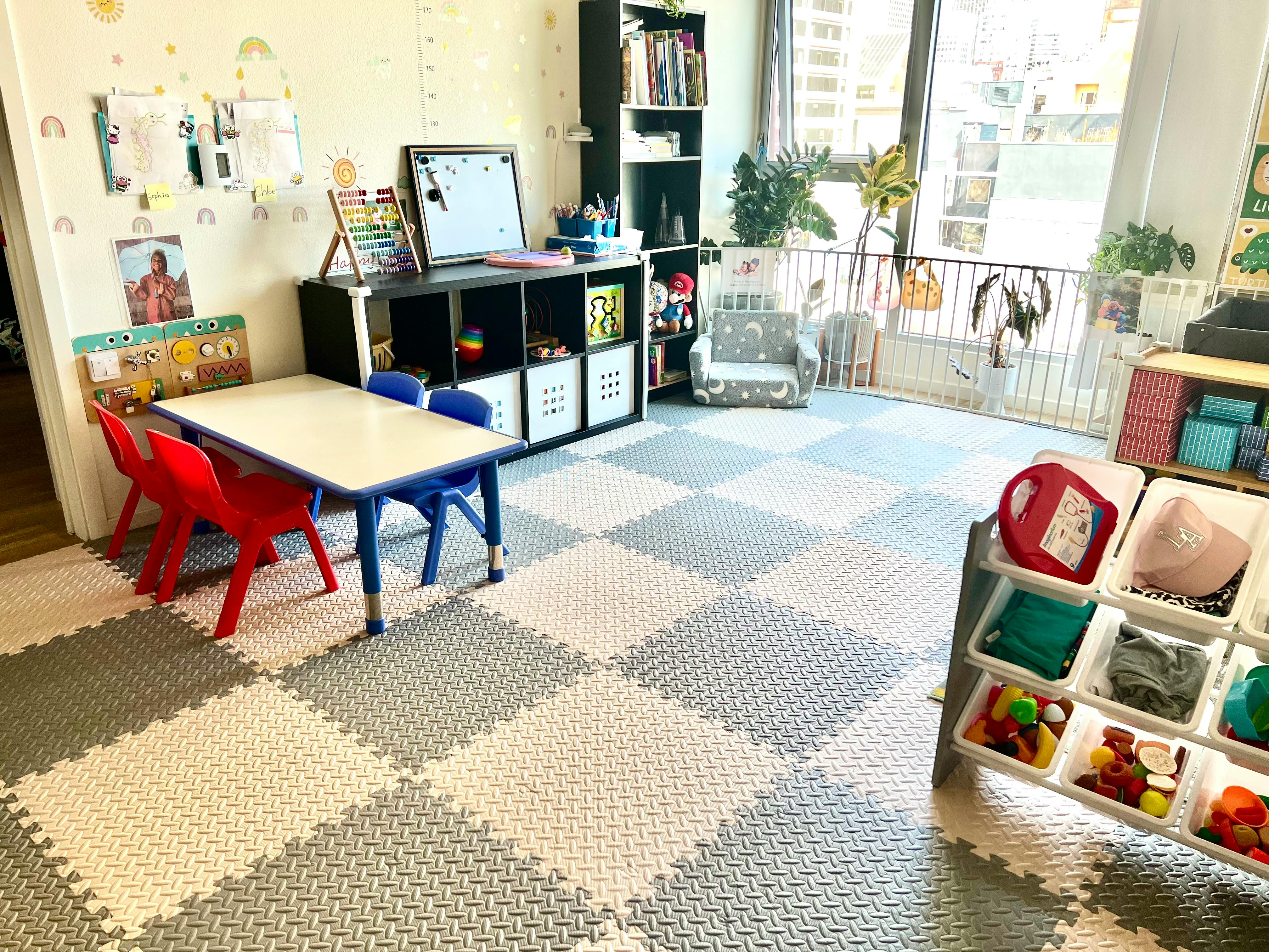 Playroom with small table and chairs on checkered floor