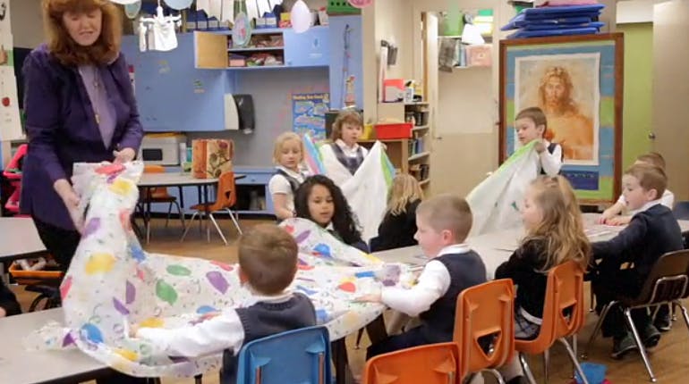 Adult and children in a classroom