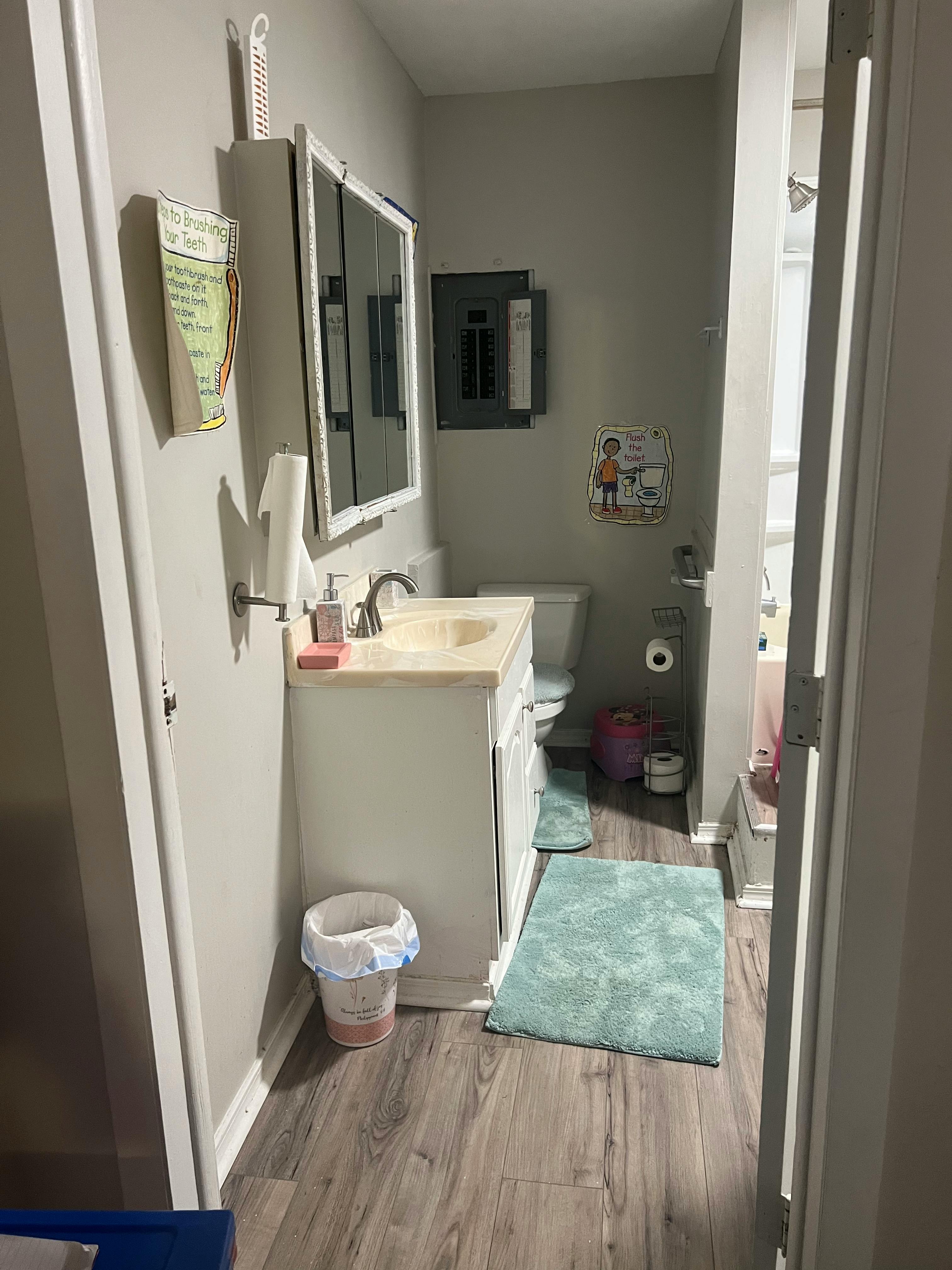Bathroom with a vanity, toilet, and shower